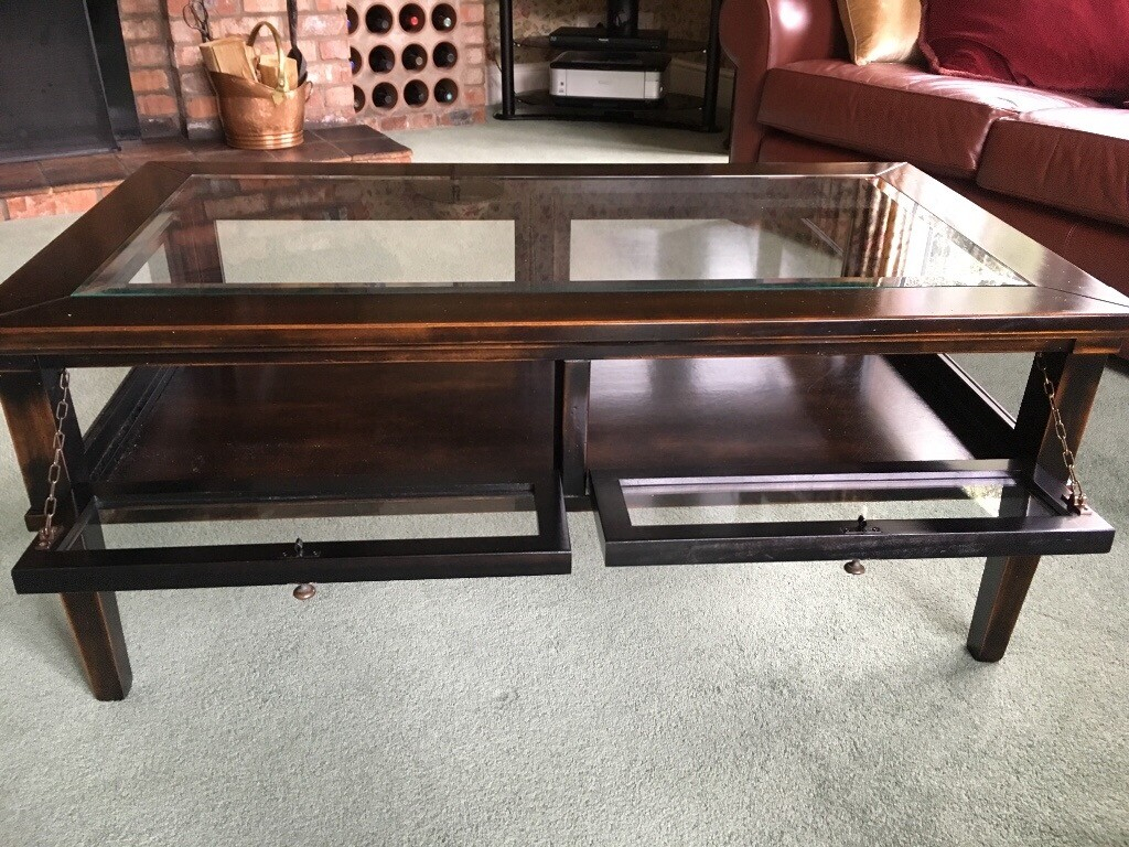 The Enduring Charm of Dark Wood and Glass Coffee Tables