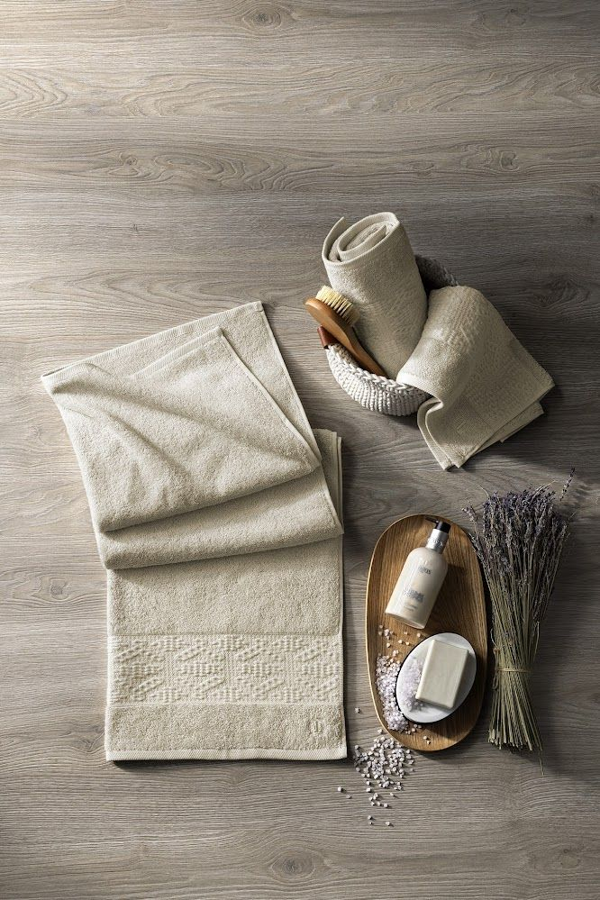 Minimalism And Aesthetics In Your Bathroom. Set Of Beige Towels Made Of ... throughout Choosing the Right Towels for Your Bathroom's Aesthetic