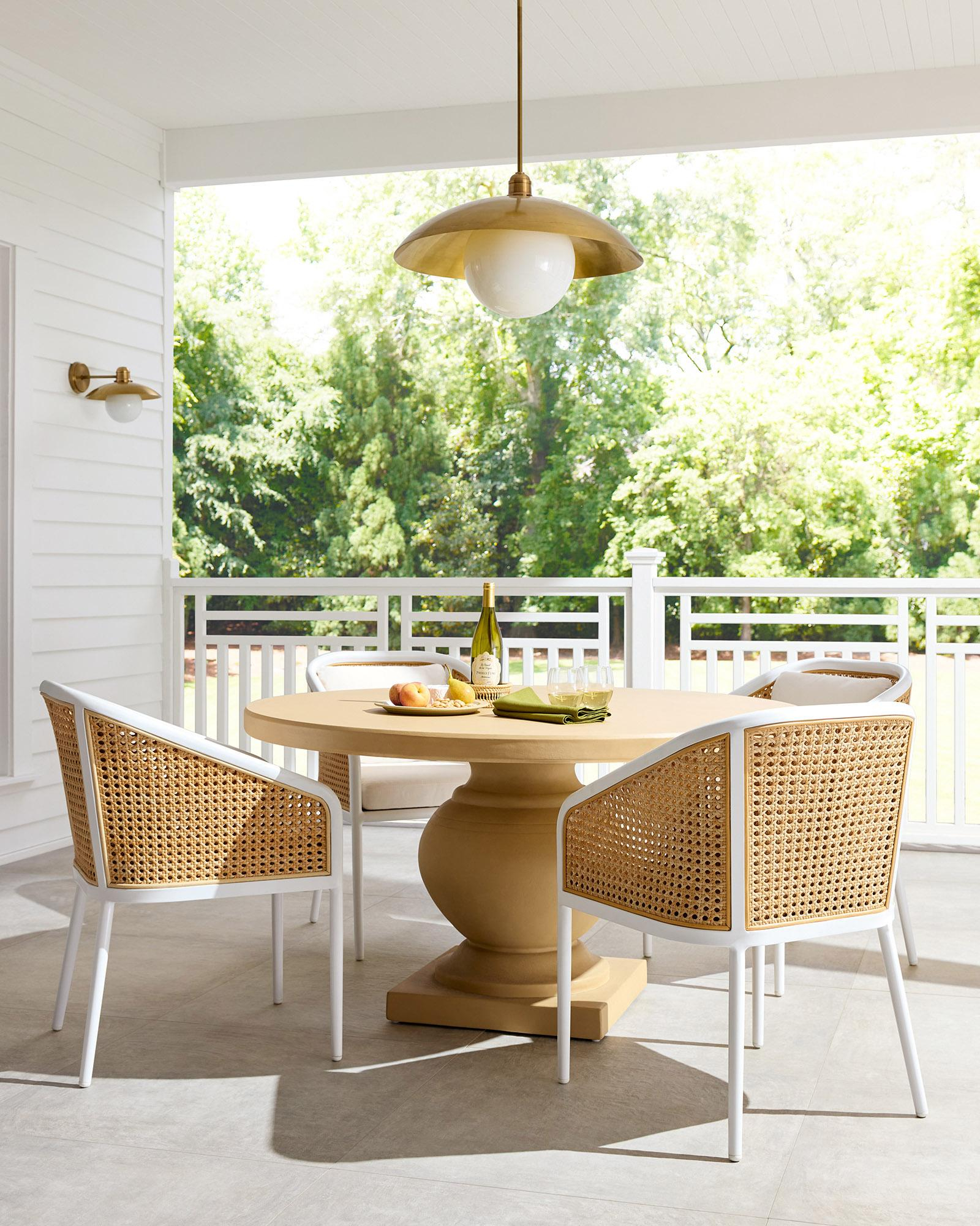 Outdoor-Dining-White-Neutral-Caning-Chairs-Puglia-Terrace-Round-Stone ... within Investing in Quality The Lasting Value of a Serena &amp;amp; Lily Dining Table