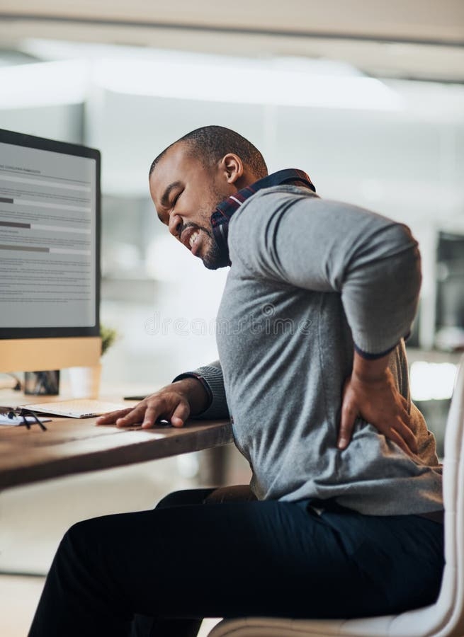 This Chair Is Tarting To Hurt My Back Now. A Young Businessman ... within The Silent Strain How Your Office Chair Might Be Hurting Your Back