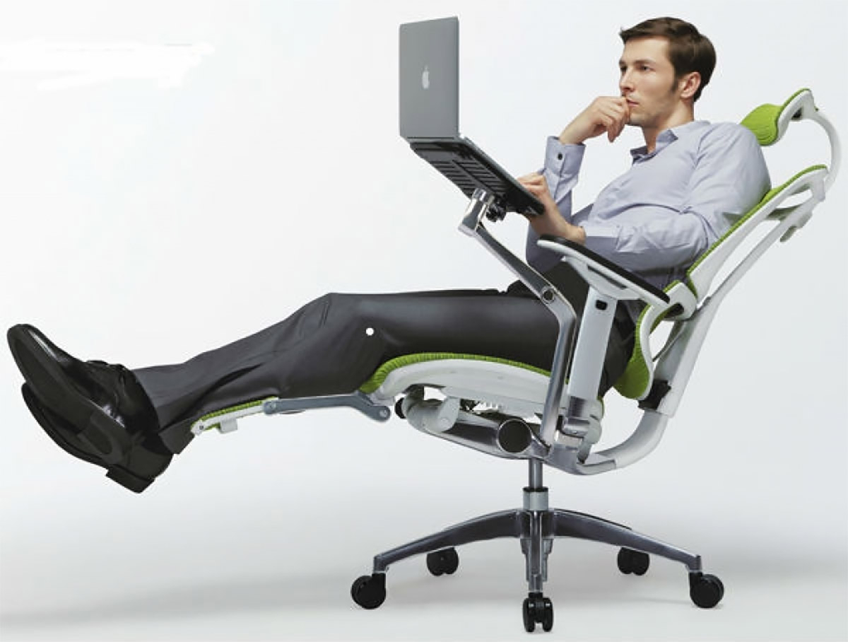 This Ultimate Office Chair Has A Laptop Mount, Leg Rests, And A Head Rest for