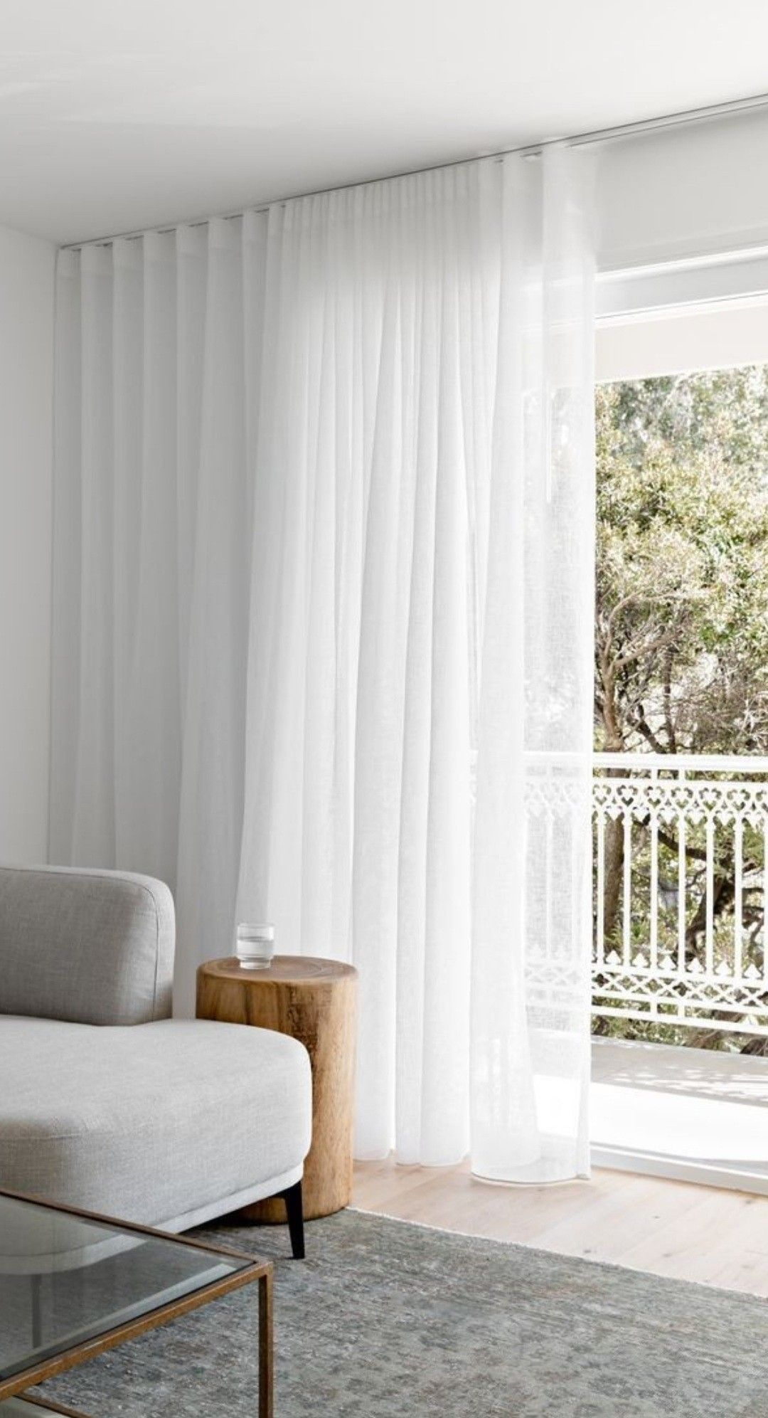 White Curtains For A Bright Living Room in