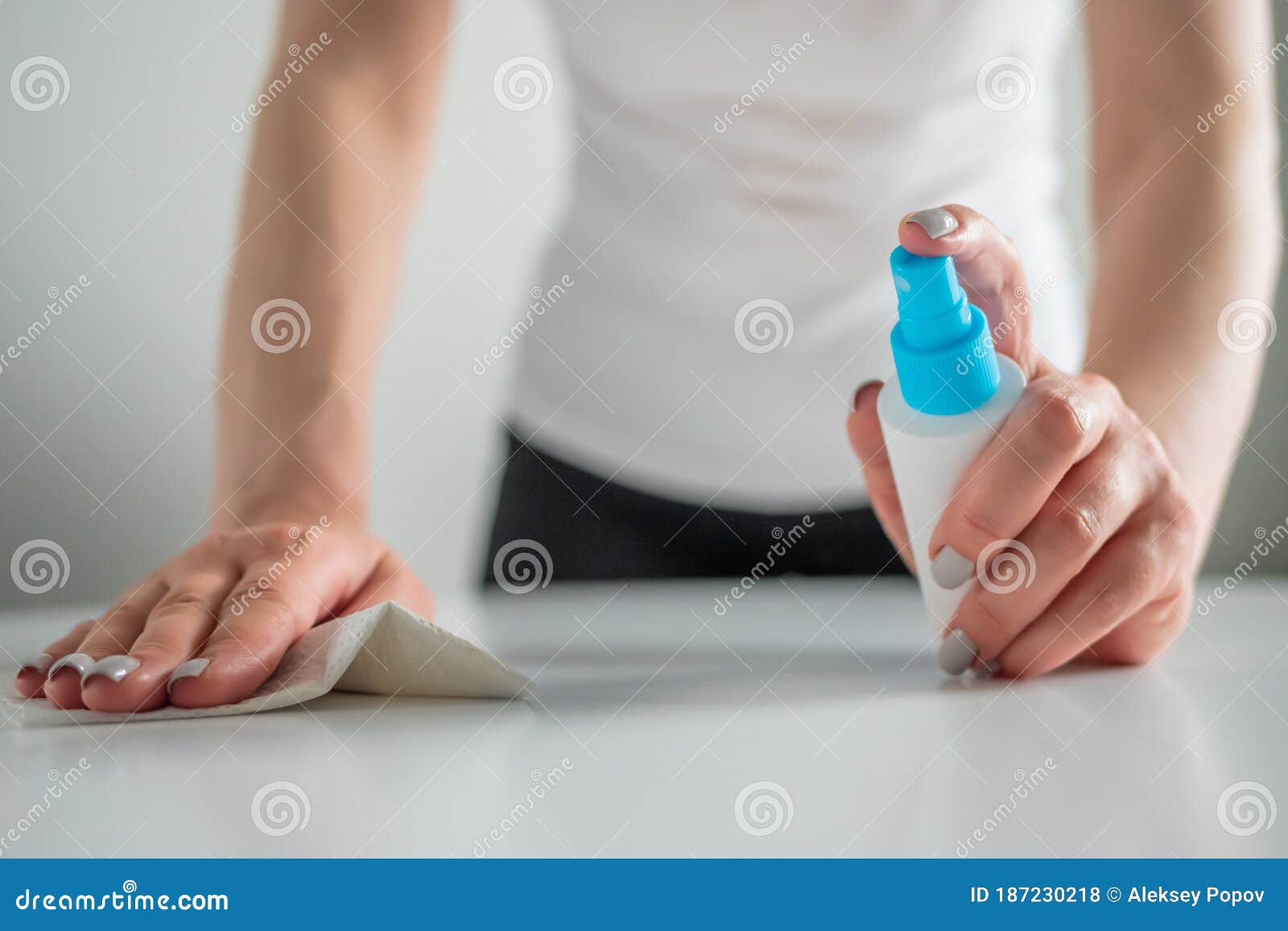 Woman Cleaning White Table With Wet Wipe - Disinfection Concept Stock ... for Effortless Dining Table Cleaning for a Pristine Home