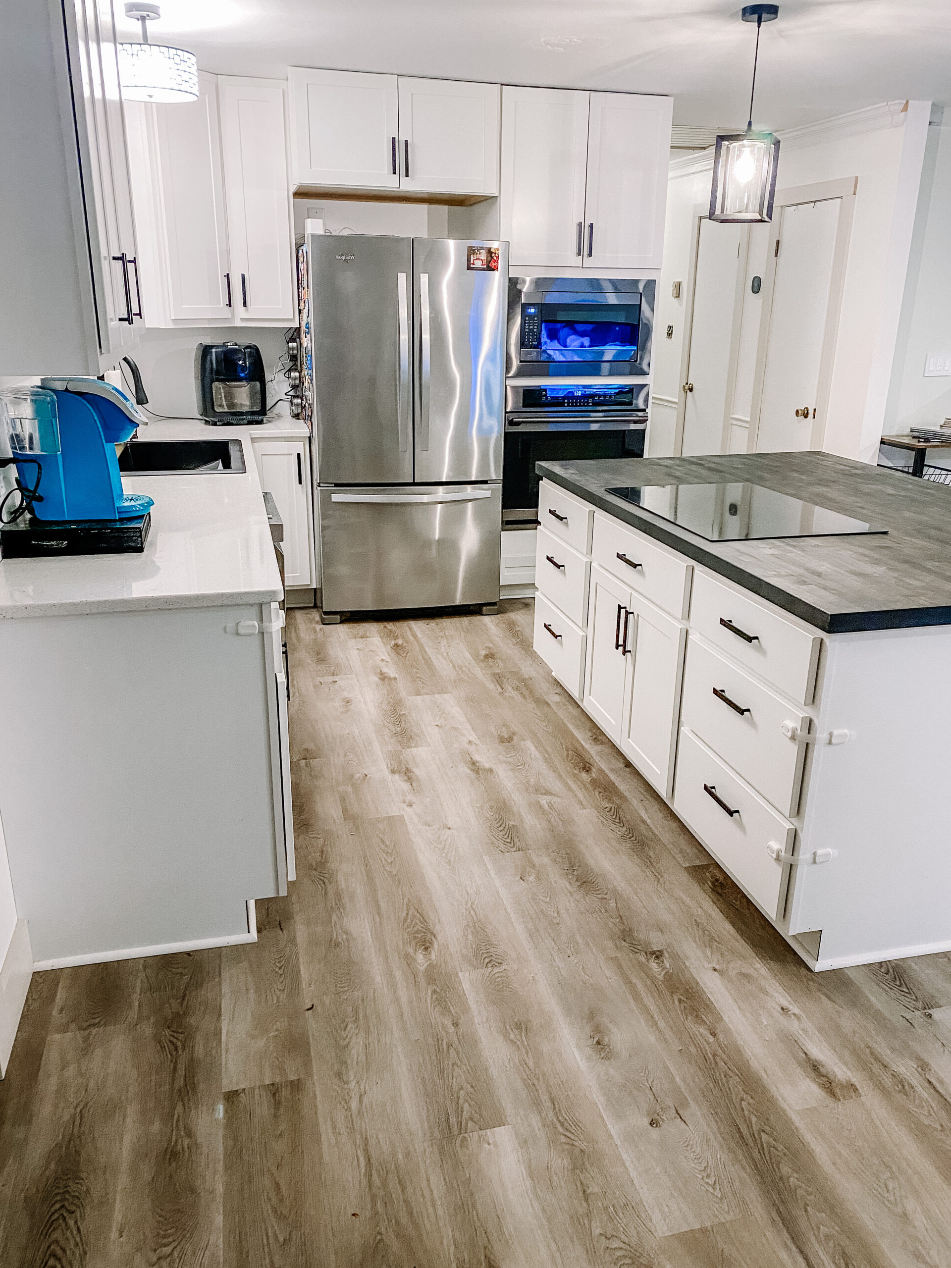Bright Modern Kitchen With Neutral Vinyl Plank Flooring inside Real-life stories of homeowners who upgraded to modern vinyl kitchen floors